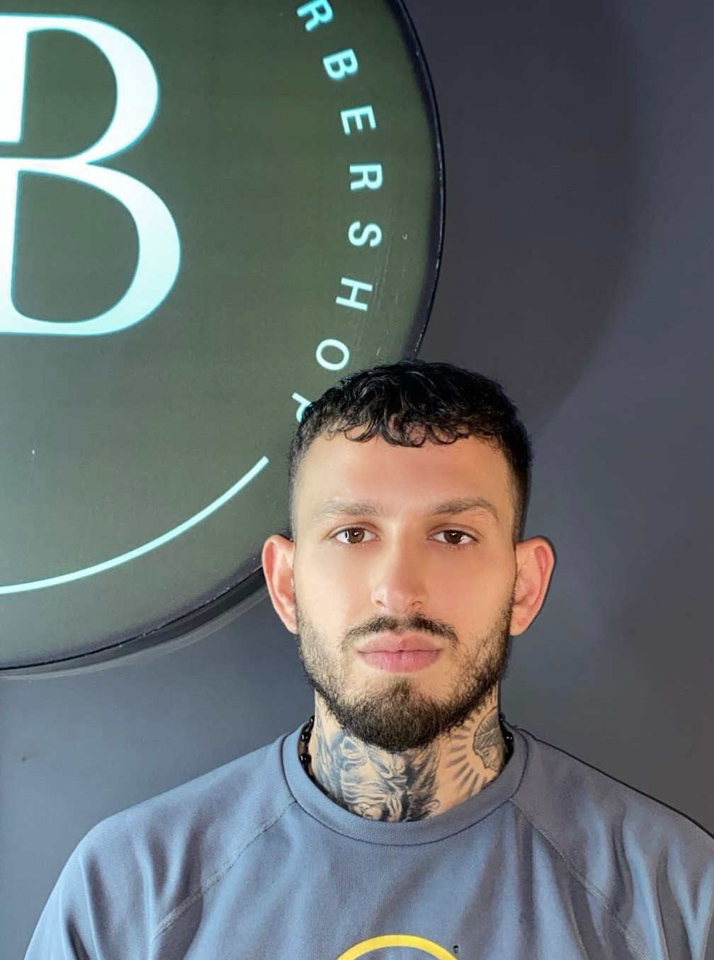 Rifat, barberare och delägare på Blessed Barbershop